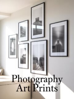 Wall with framed black and white photography art prints in modern decor.