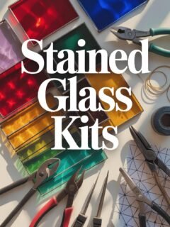 Colorful stained glass kits with tools on a table, ideal for crafting and DIY art projects.